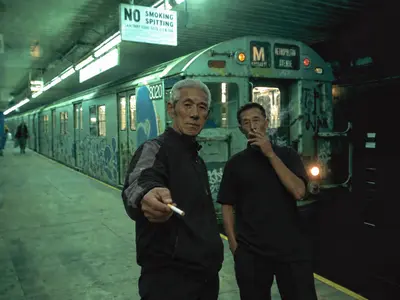 Men Smoking Under No Smoking Sign