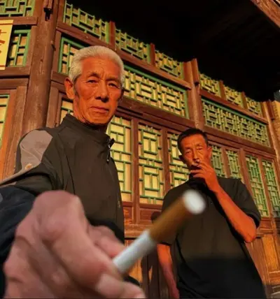 Old Man Offers Cigarette Close-Up